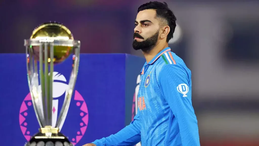 A Dissapointed Virat Kohli walks past the 2023 ODI WC Trophy after the Final Loss in Ahmedabad